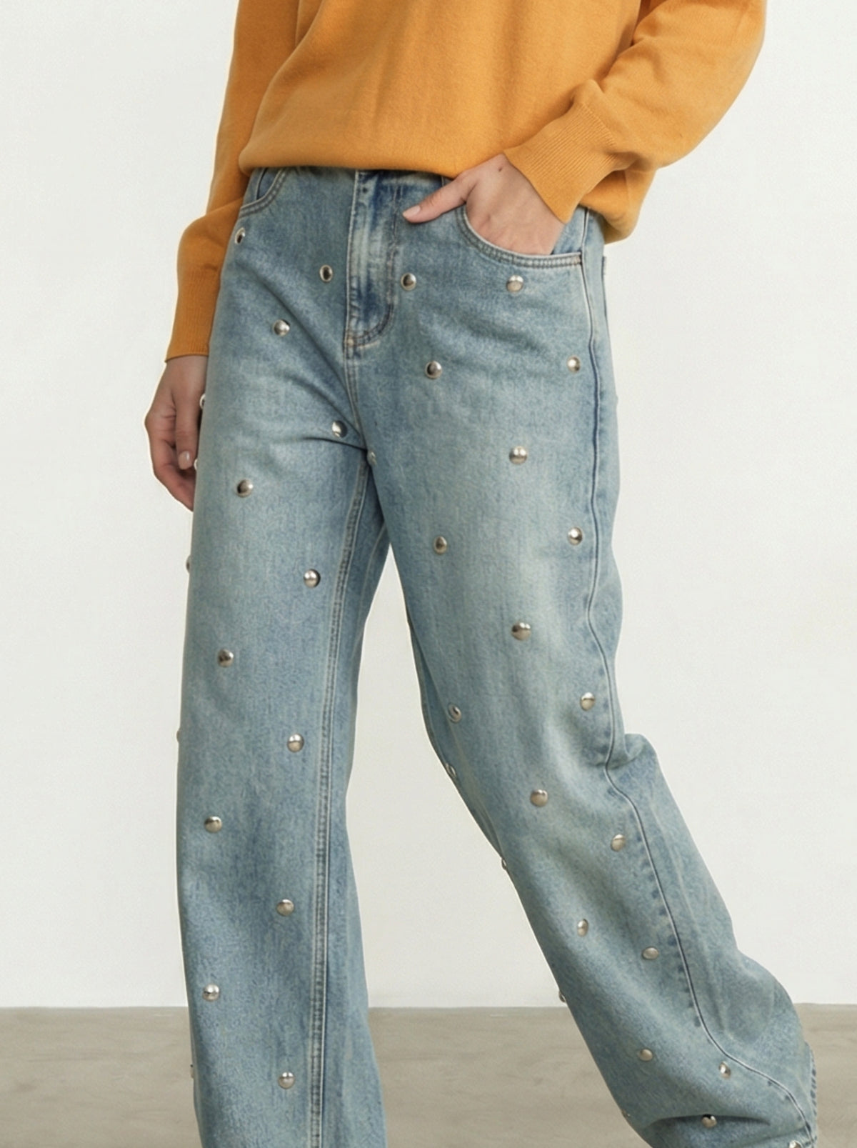 JEANS CON BORCHIE ALL-OVER
