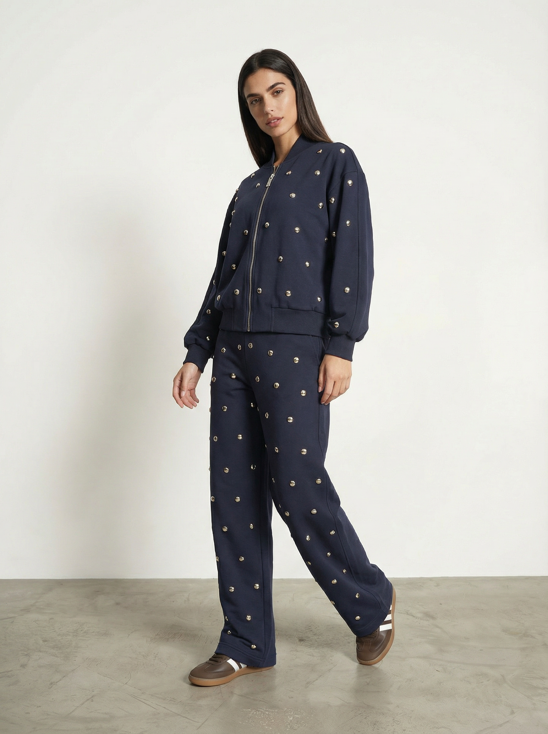 PANTALONE CON BORCHIE ALL-OVER