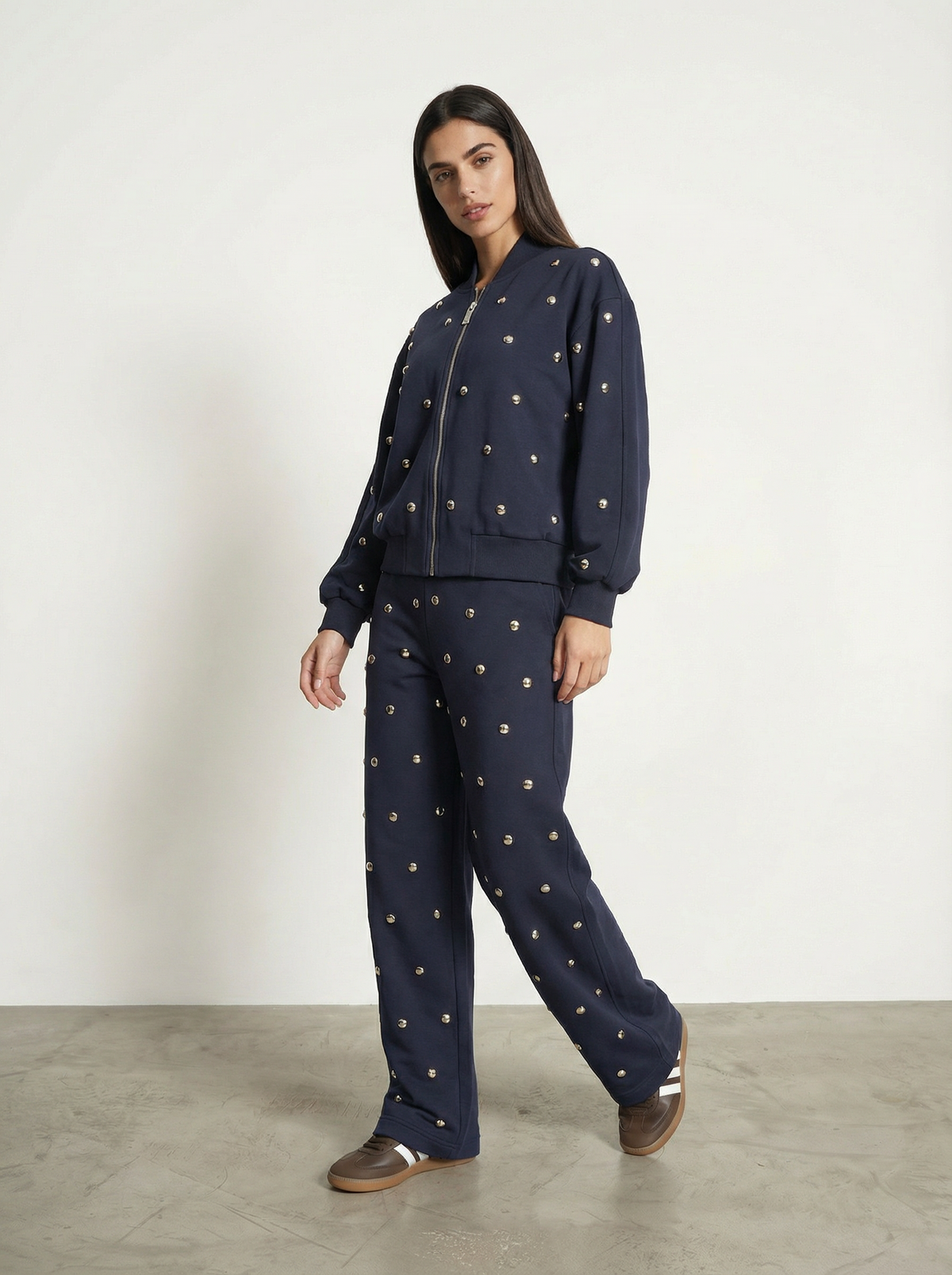 PANTALONE CON BORCHIE ALL-OVER