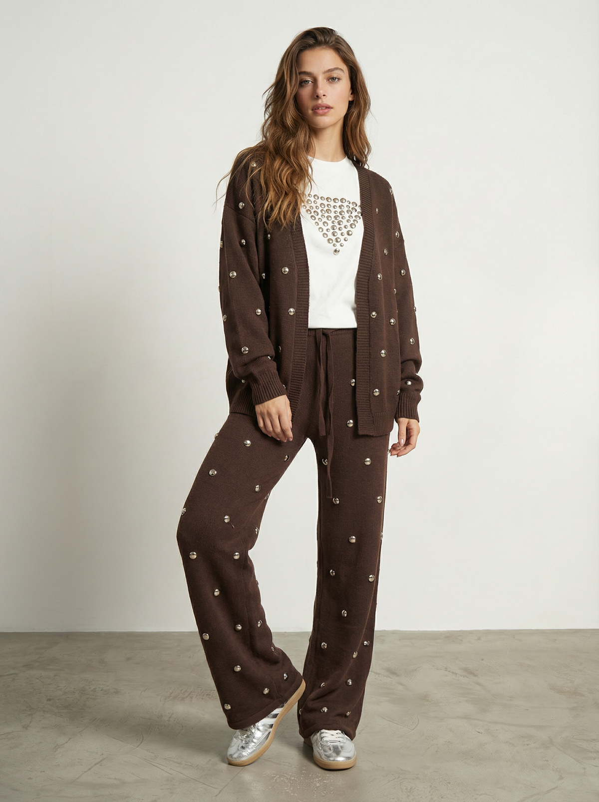 PANTALONI CON BORCHIE ALL-OVER